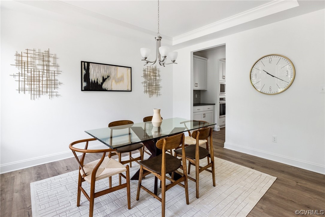 8357 Capernwray Drive Chesterfield, VA 23838 - Photo 5 of 50 a view of a dining room with furniture and wooden floor