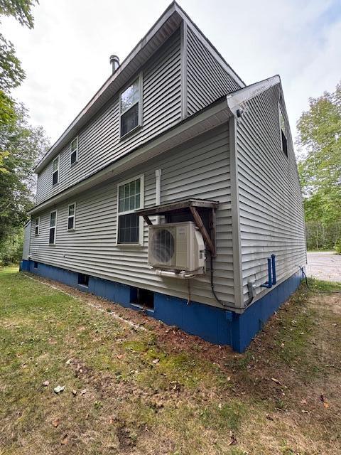 28 Glover Road Rumford, ME 04276 - Photo 8 of 22 back of house heat pump