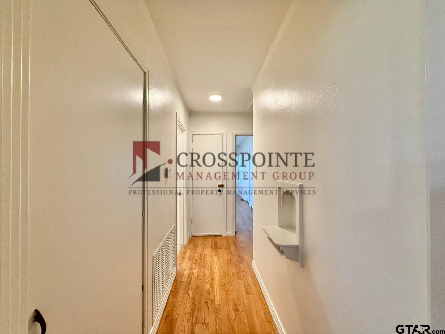 10120 FM 346 Flint, TX 75762 - Photo 18 of 35 a view of a hallway with wooden floor