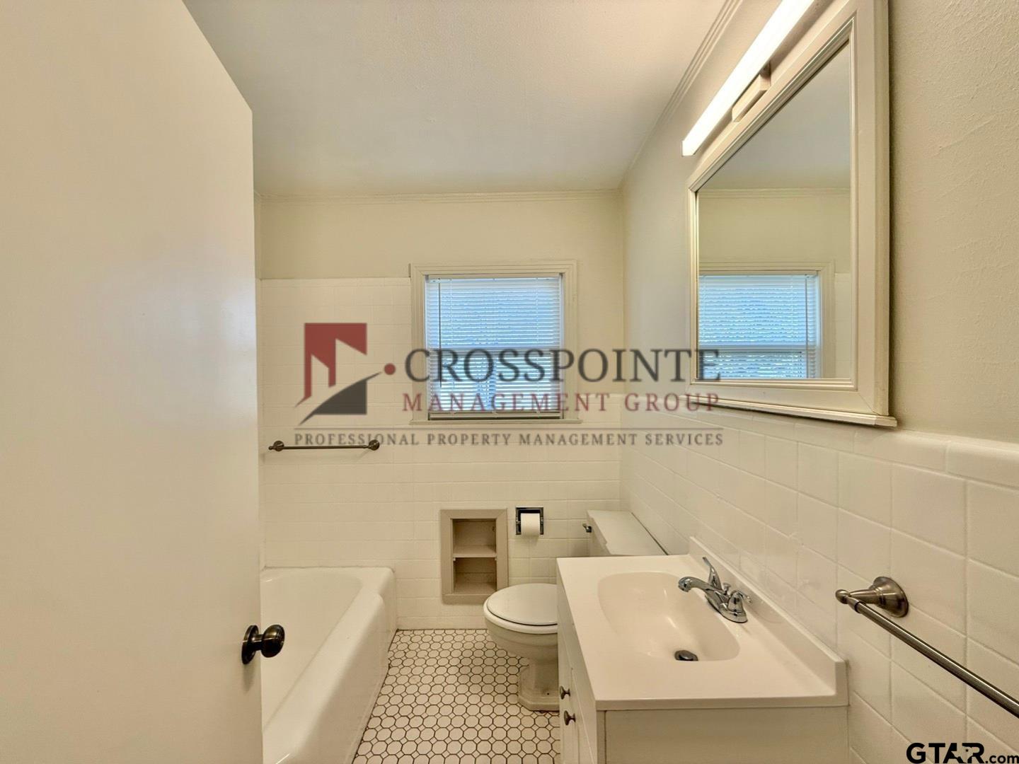 10120 FM 346 Flint, TX 75762 - Photo 21 of 35 a bathroom with a sink and a mirror