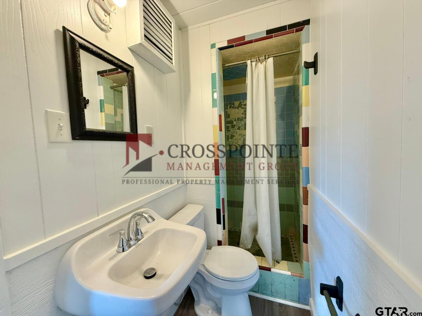 10120 FM 346 Flint, TX 75762 - Photo 32 of 35 a bathroom with a toilet sink and mirror