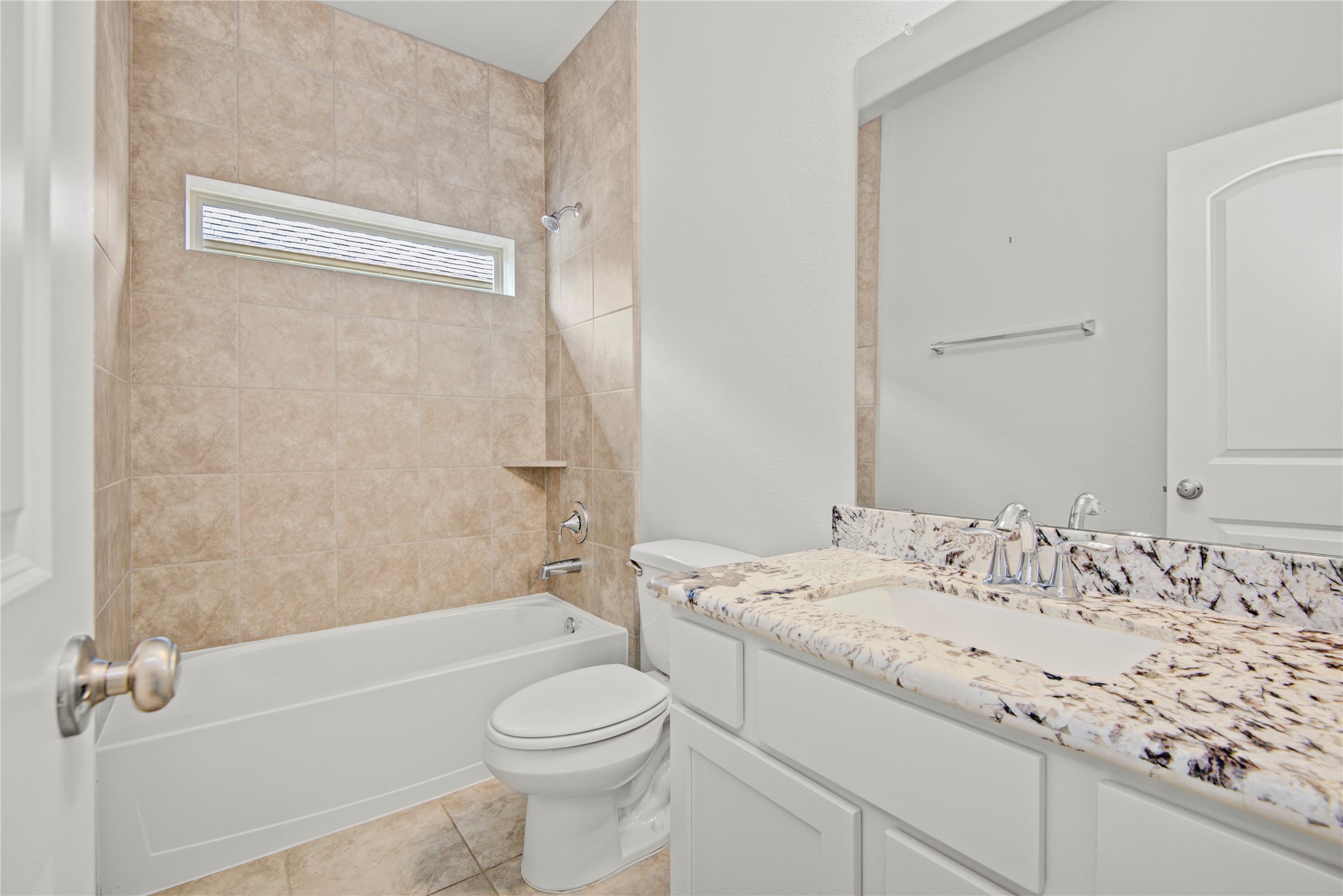 1314 Orchard Ridge Lane Tomball, TX 77375 - Photo 27 of 35 The secondary bathroom features a clean design with a shower/tub combination and functional layout.