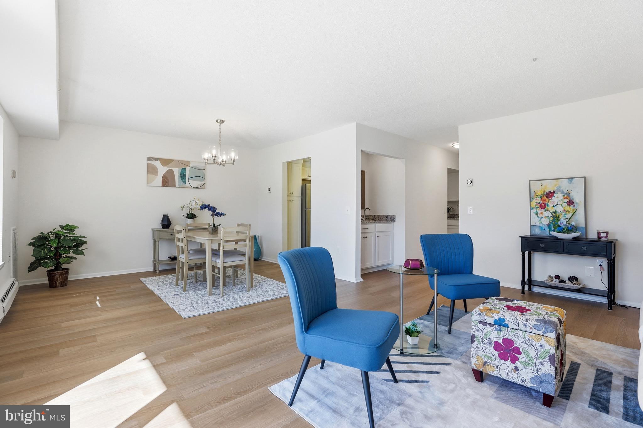 3500 Forest Edge Drive, Unit 152F Silver Spring, MD 20906 - Photo 12 of 31 a living room with furniture and wooden floor