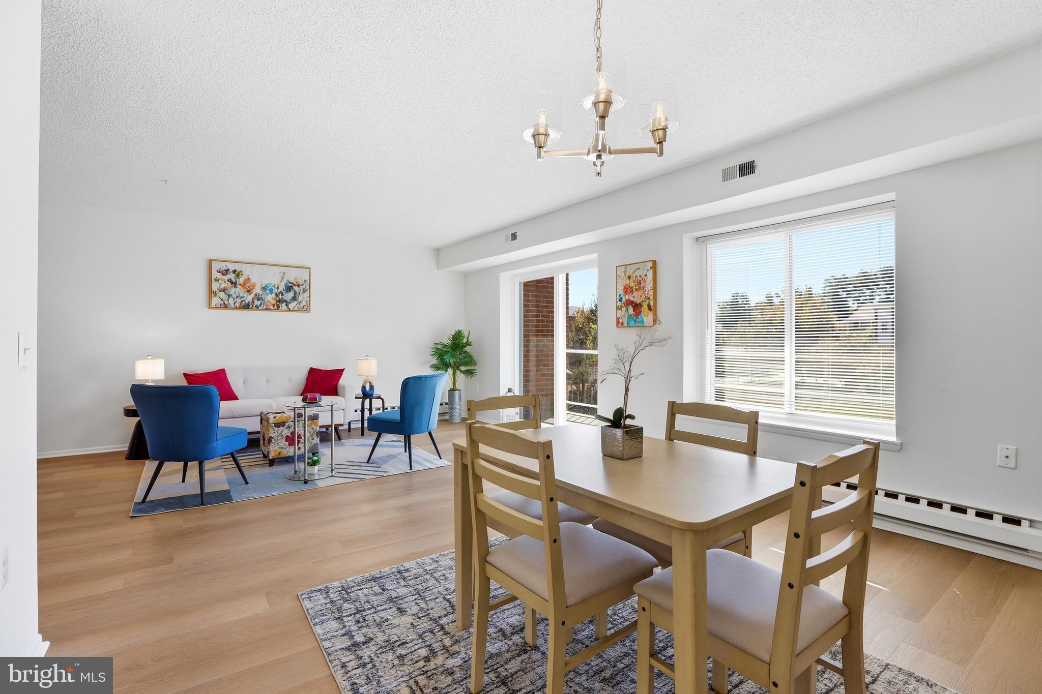3500 Forest Edge Drive, Unit 152F Silver Spring, MD 20906 - Photo 15 of 31 a view of a dining room with furniture window and outside view
