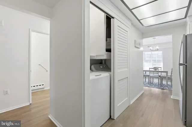 a kitchen with stainless steel appliances granite countertop a refrigerator a stove a sink and a microwave