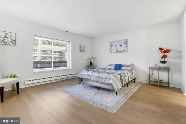 a bedroom with a bed and a table