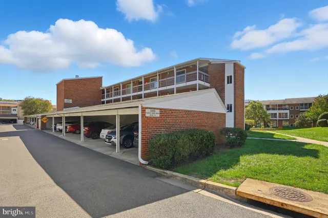 a view of a brick house with many windows