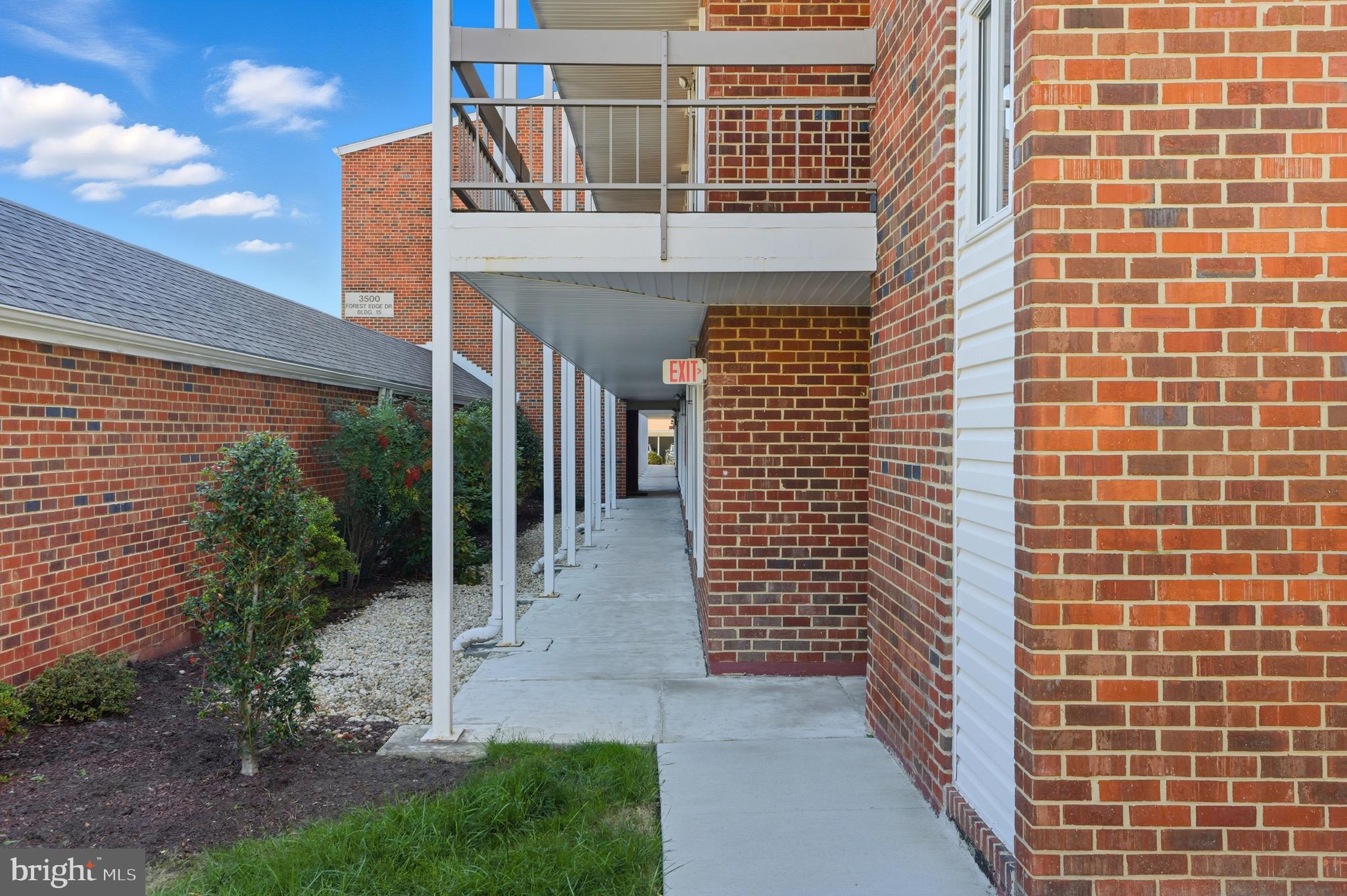 3500 Forest Edge Drive, Unit 152F Silver Spring, MD 20906 - Photo 30 of 31 a view of a brick house with many windows