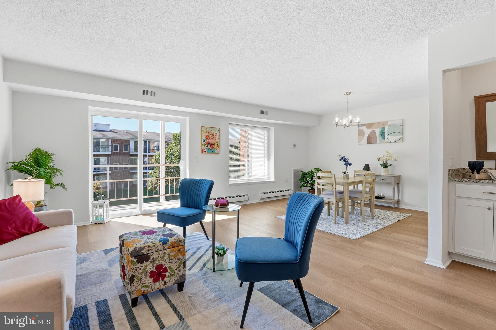 3500 Forest Edge Drive, Unit 152F Silver Spring, MD 20906 - Photo 10 of 31 a living room with furniture and a flat screen tv