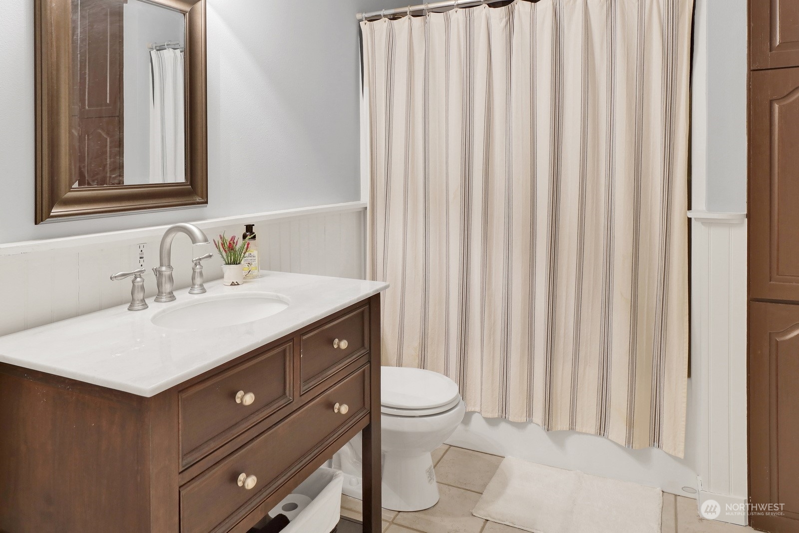5747 Silverstar Road Bellingham, WA 98226 - Photo 28 of 40 a bathroom with a sink a toilet and mirror