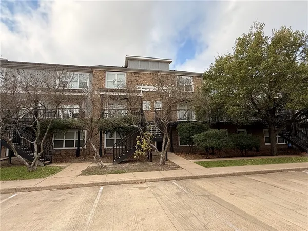 a view of a a dining room with furniture window and wooden floor