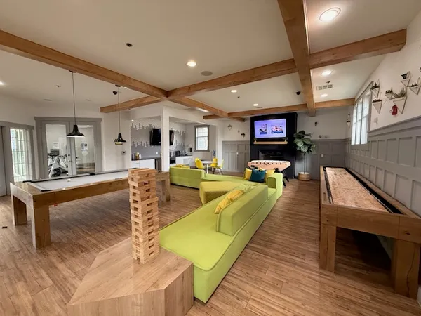 a view of a backyard with sitting area