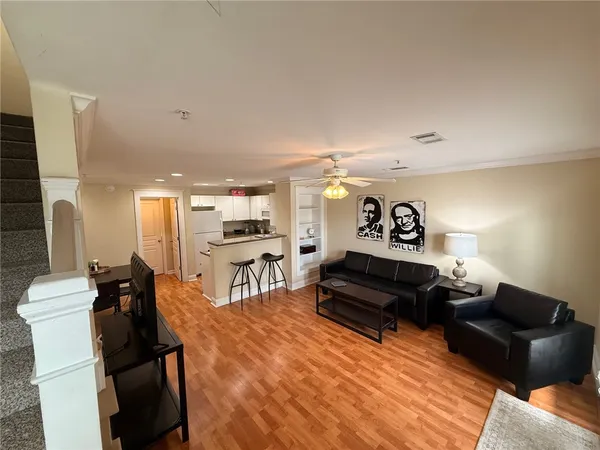 a bathroom with a granite countertop toilet sink and shower