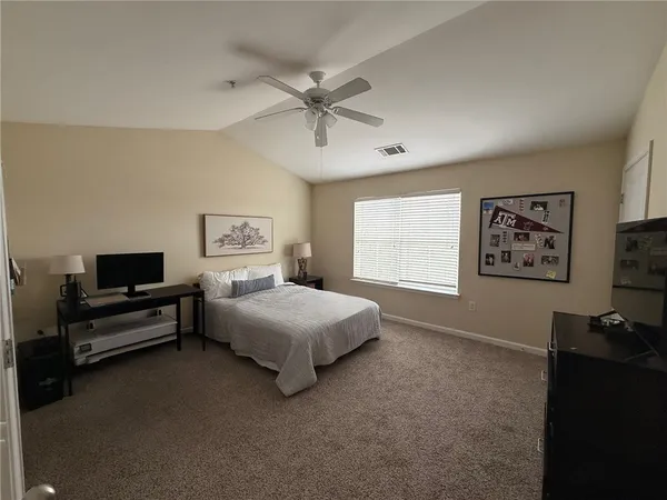 an empty room with a empty space and a ceiling fan