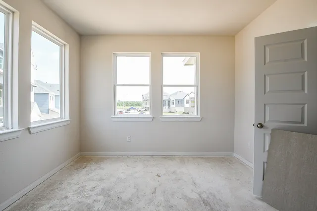 an empty room with windows