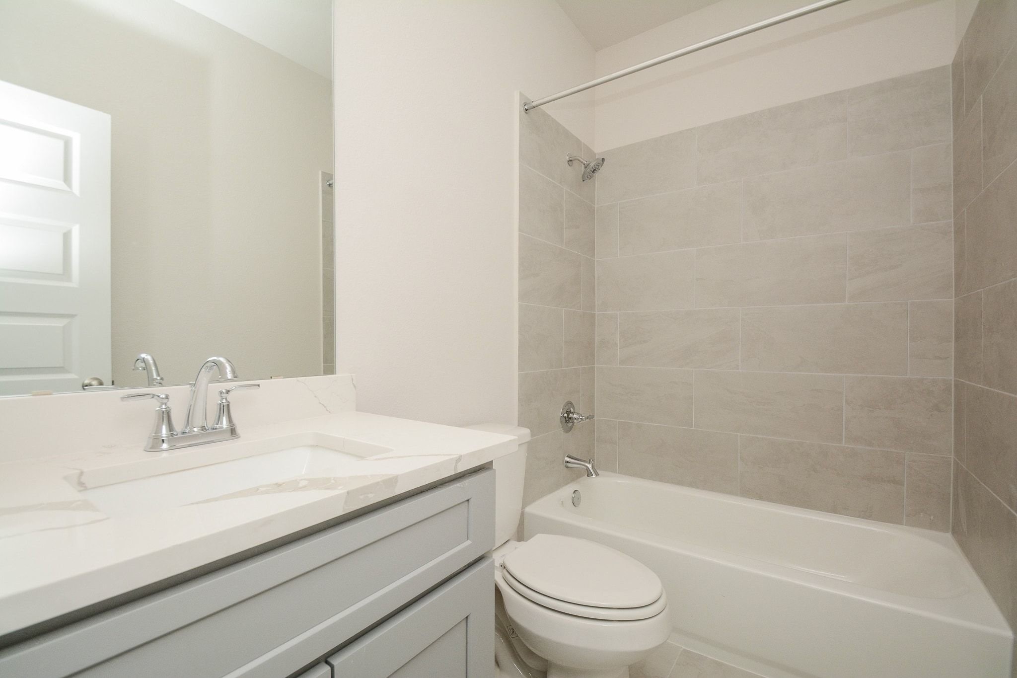20629 Dynamic Court Humble, TX 77338 - Photo 21 of 36 a bathroom with a granite countertop sink a toilet and shower
