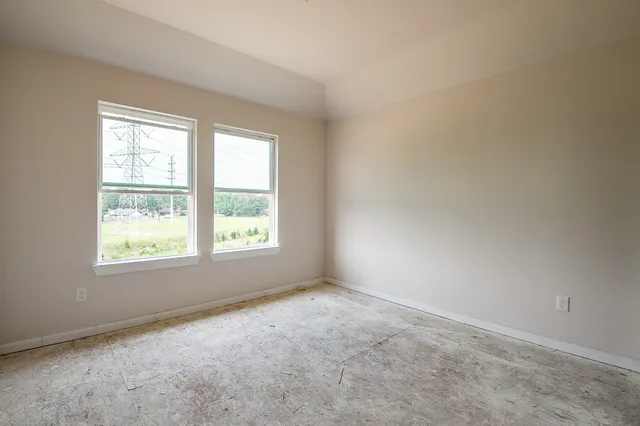 a bathroom with a granite countertop toilet a sink and a bathtub