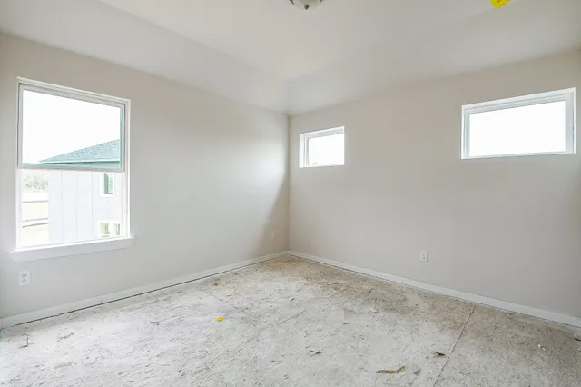 an empty room with windows