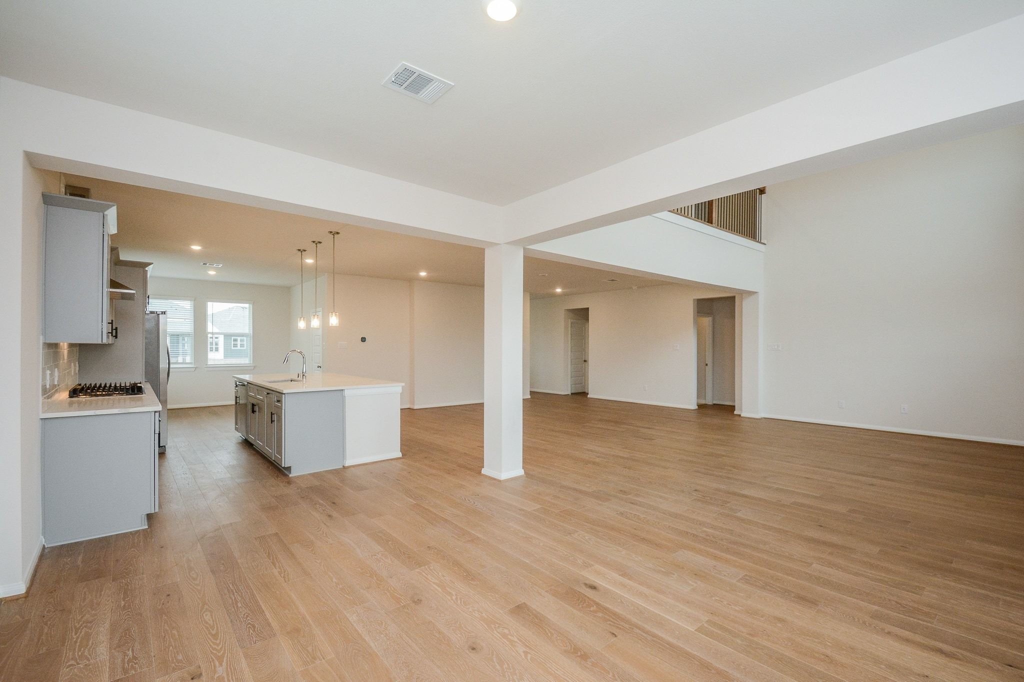 20629 Dynamic Court Humble, TX 77338 - Photo 5 of 36 a view of a big room with wooden floor and windows