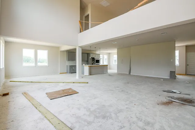 a living room with furniture and a table