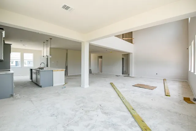a view of a kitchen with a sink and cabinets