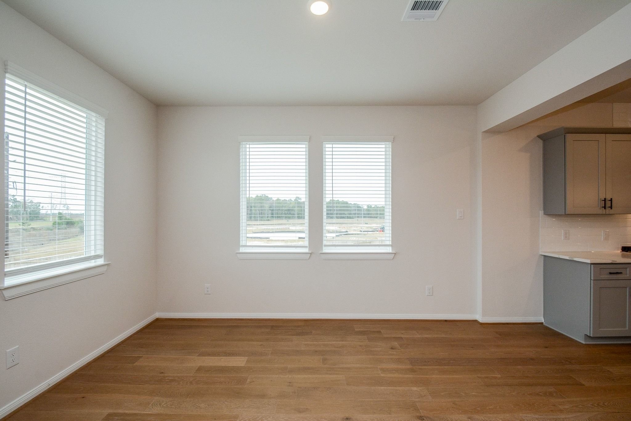 20629 Dynamic Court Humble, TX 77338 - Photo 10 of 36 a view of an empty room with window and wooden floor