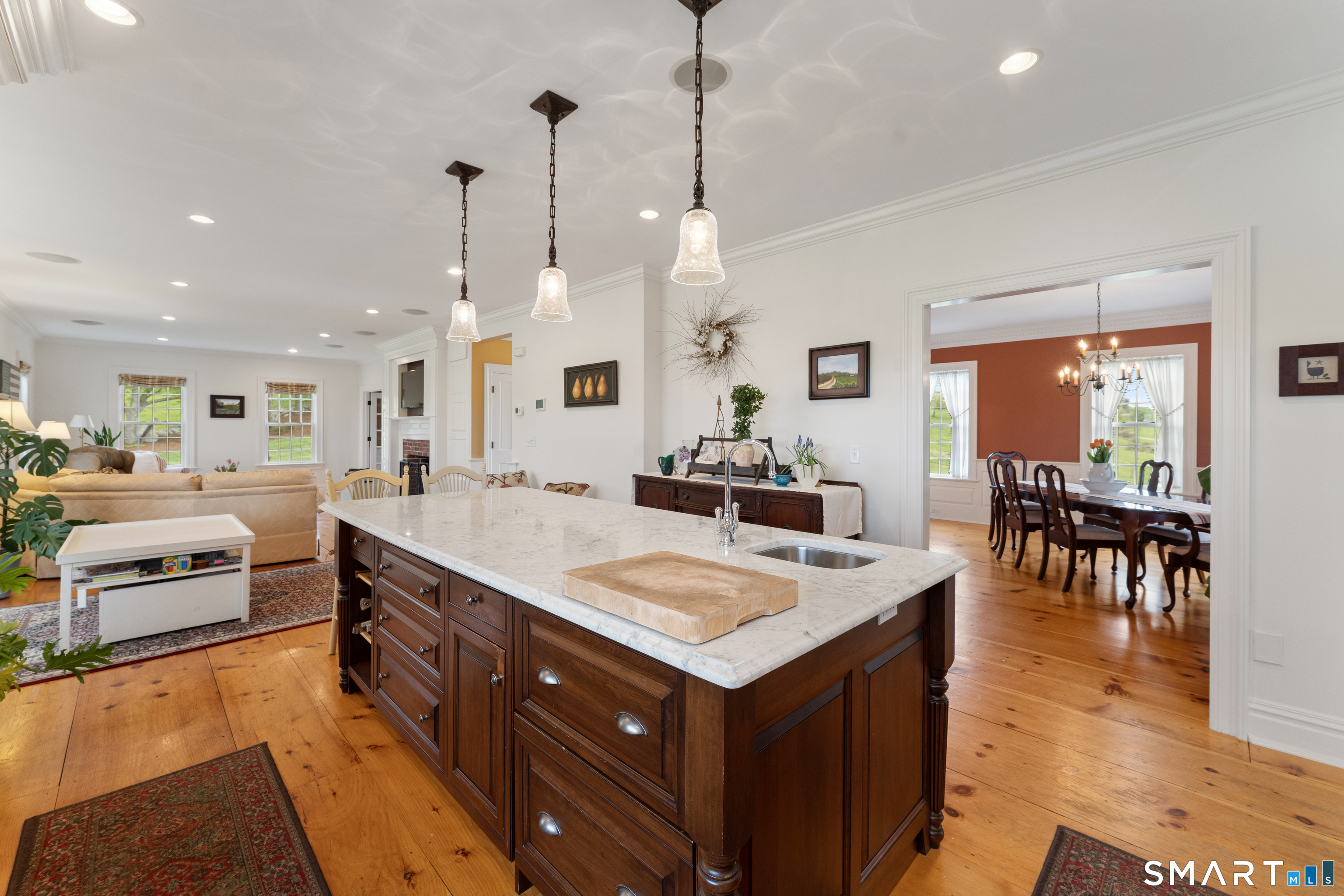155 Paine Road Woodstock, CT 06281 - Photo 14 of 40 a large kitchen with kitchen island a sink counter space and living room view