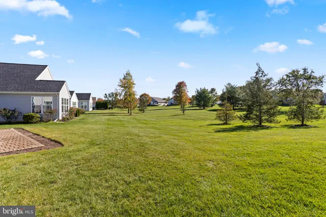 a view of a fountain in front of the house