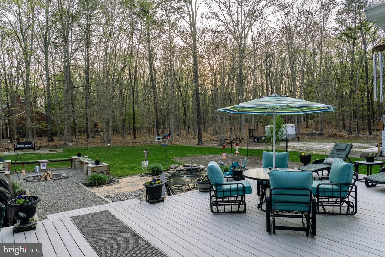 17 Red Oak Drive Tabernacle, NJ 08088 - Photo 39 of 45 a view of a table and chairs in patio of the house