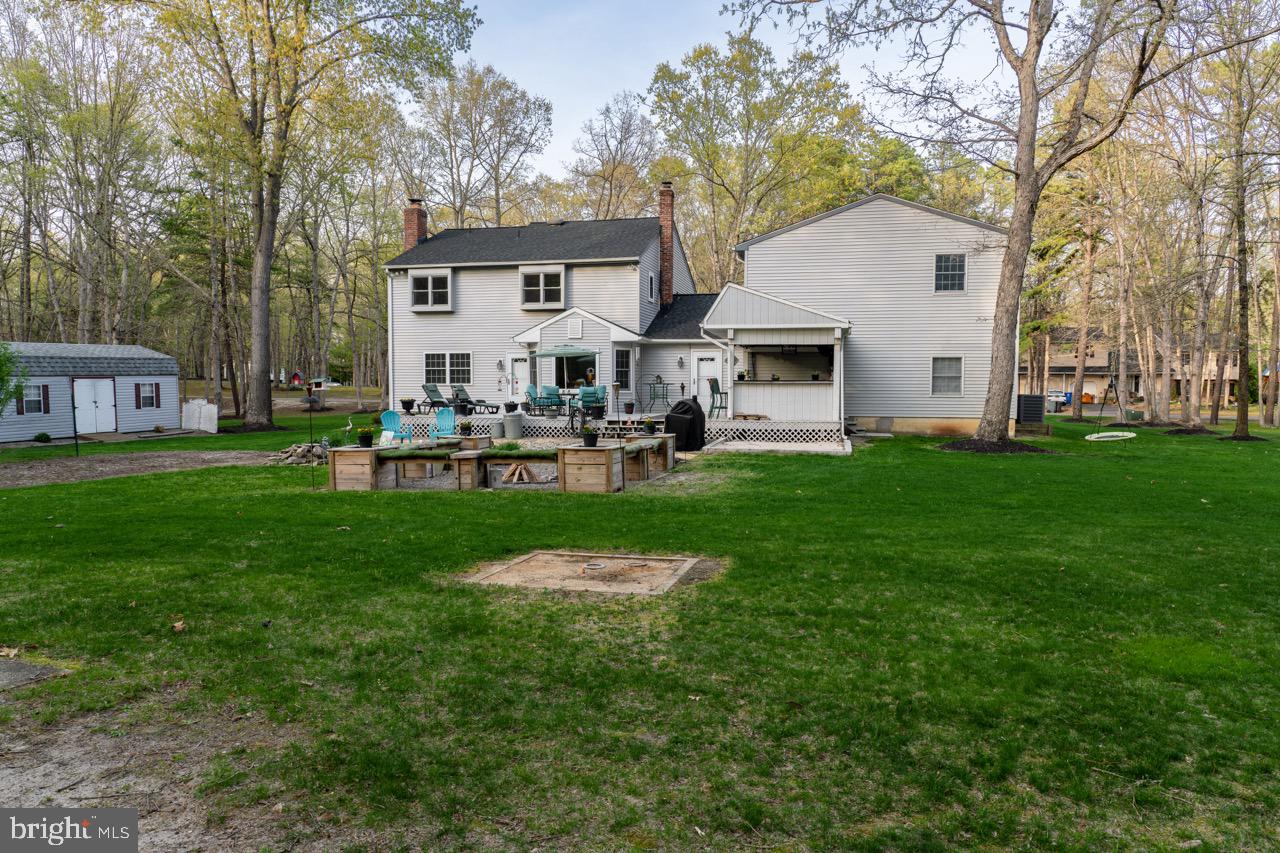 17 Red Oak Drive Tabernacle, NJ 08088 - Photo 41 of 45 a front view of house with a garden and trees