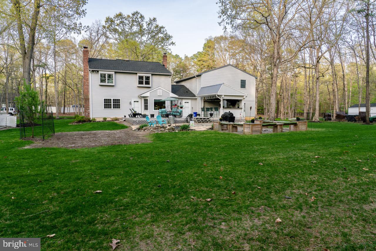 17 Red Oak Drive Tabernacle, NJ 08088 - Photo 42 of 45 a front view of a house with garden and trees