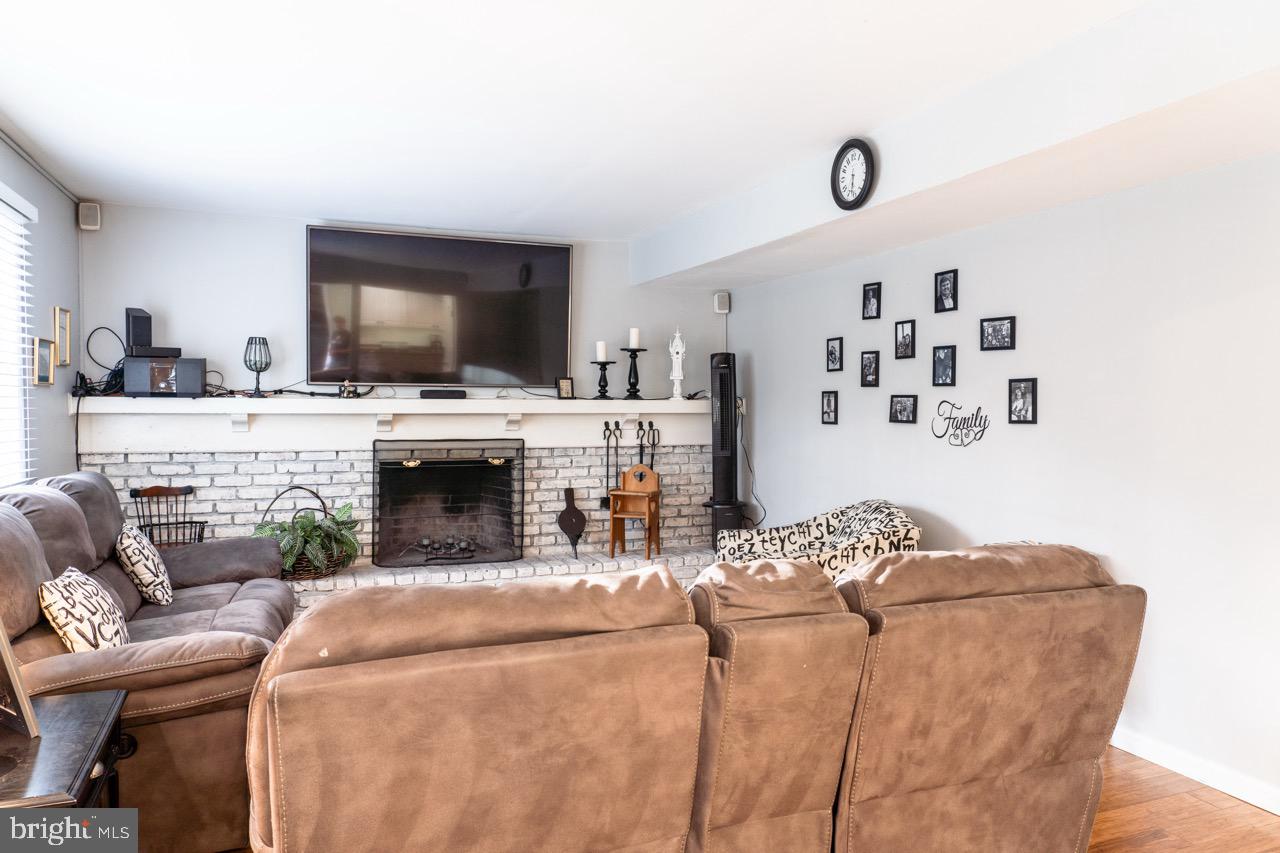 17 Red Oak Drive Tabernacle, NJ 08088 - Photo 6 of 45 a living room with furniture a fireplace and flat screen tv