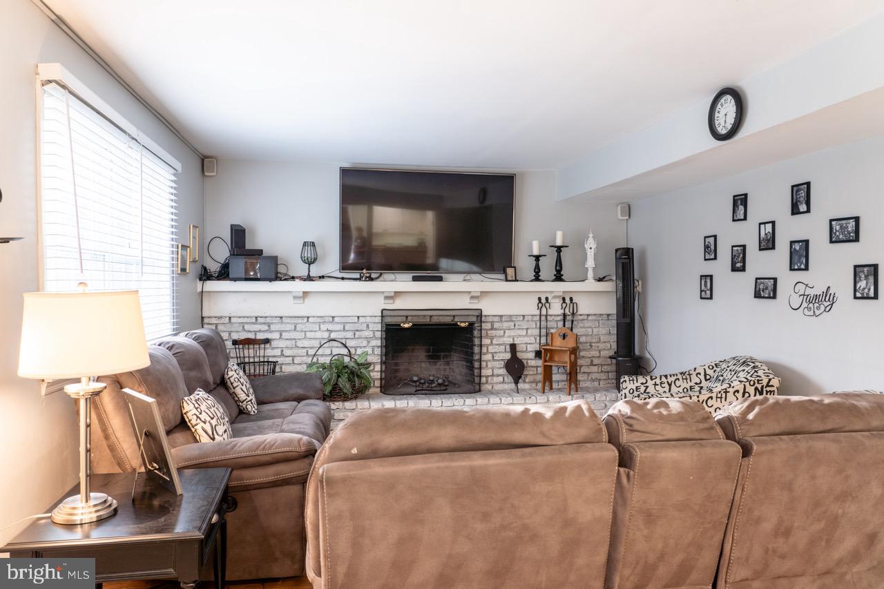 17 Red Oak Drive Tabernacle, NJ 08088 - Photo 7 of 45 a living room with furniture a fireplace and a flat screen tv