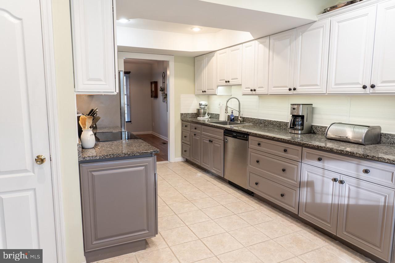 17 Red Oak Drive Tabernacle, NJ 08088 - Photo 8 of 45 a kitchen with stainless steel appliances granite countertop a sink and cabinets
