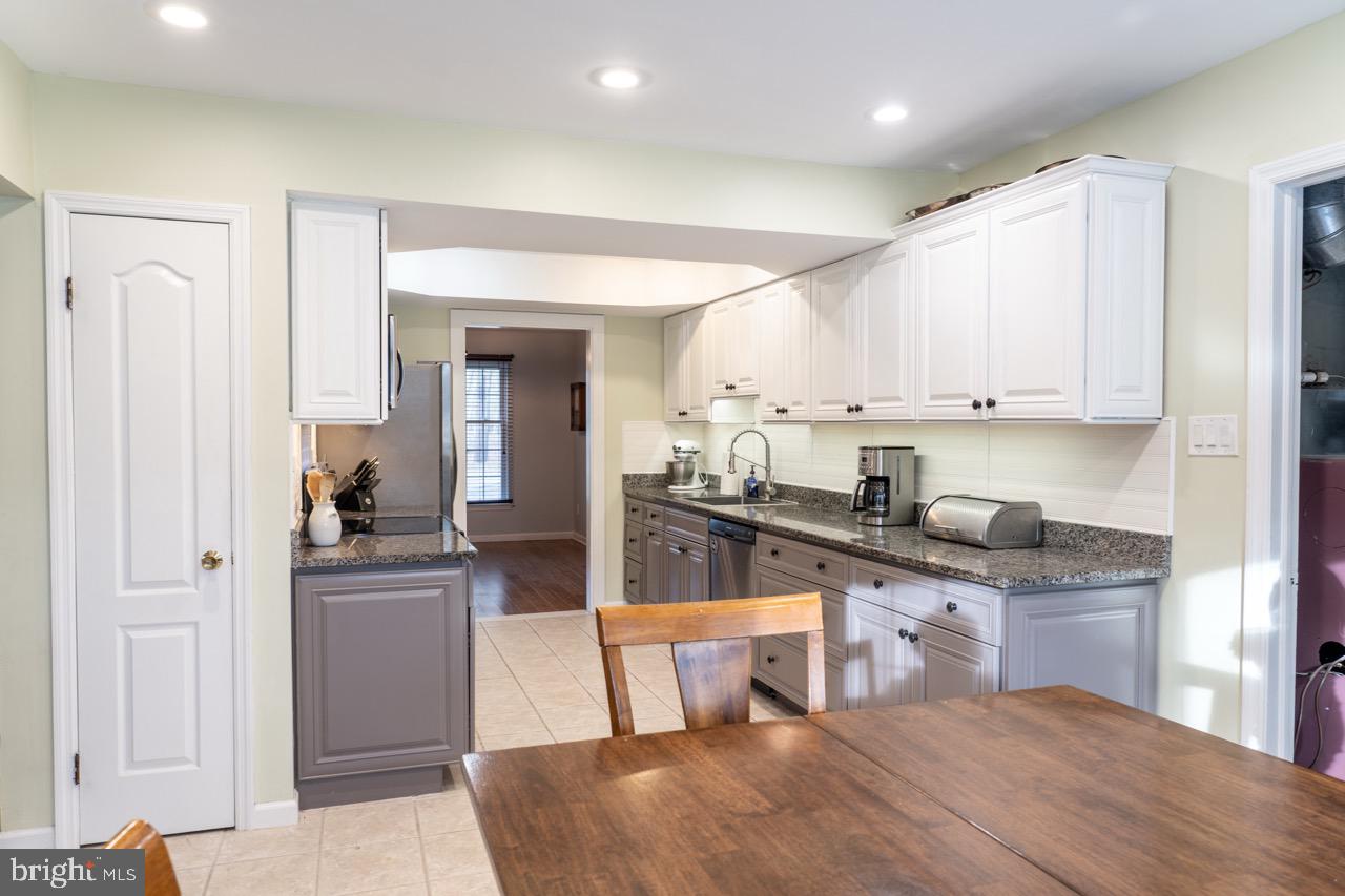 17 Red Oak Drive Tabernacle, NJ 08088 - Photo 9 of 45 a kitchen with stainless steel appliances granite countertop a sink and cabinets