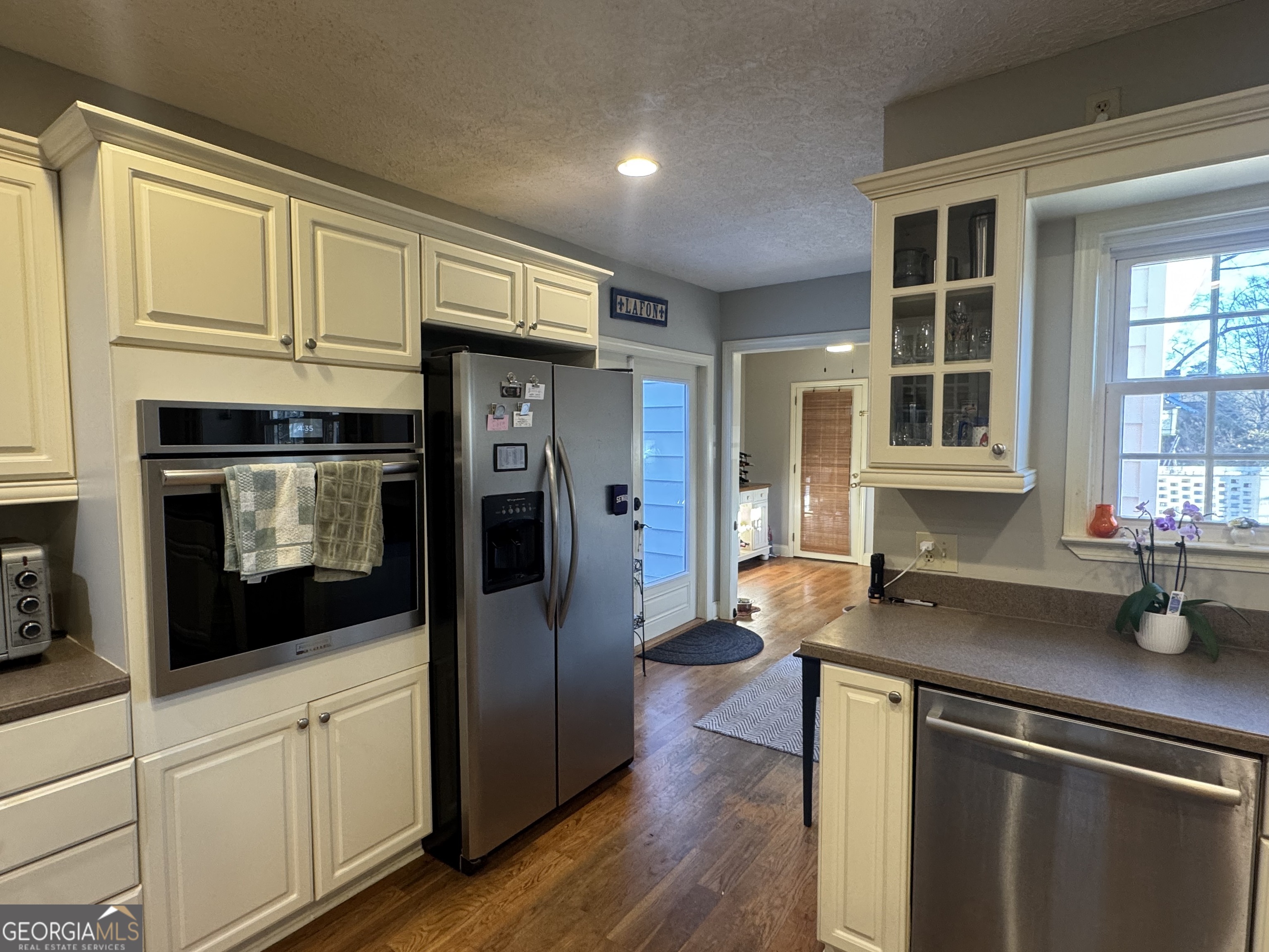 722 Maple Drive Griffin, GA 30224 - Photo 11 of 28 a kitchen with stainless steel appliances granite countertop a refrigerator and a sink