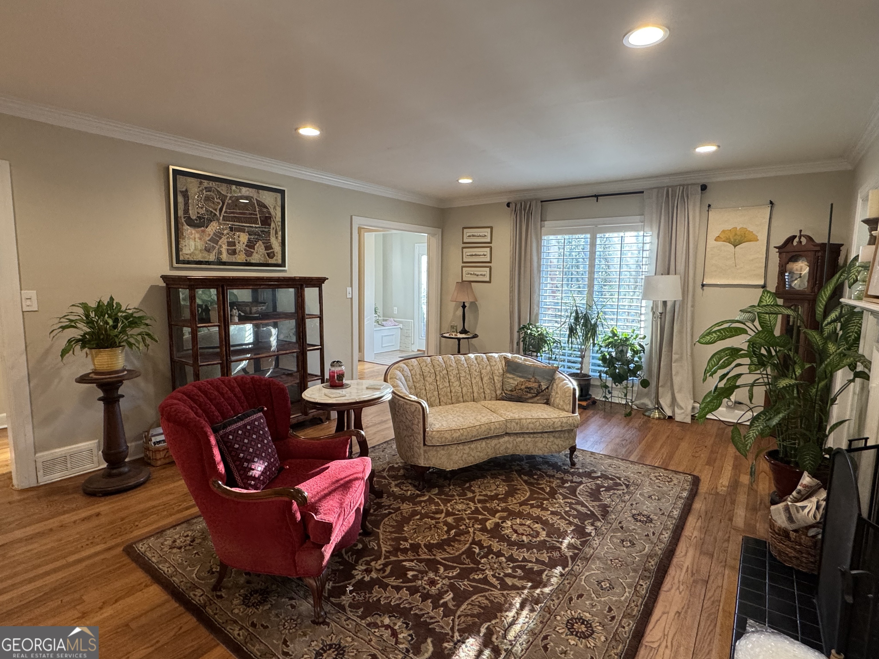 722 Maple Drive Griffin, GA 30224 - Photo 28 of 28 a living room with furniture or couch and a potted plant