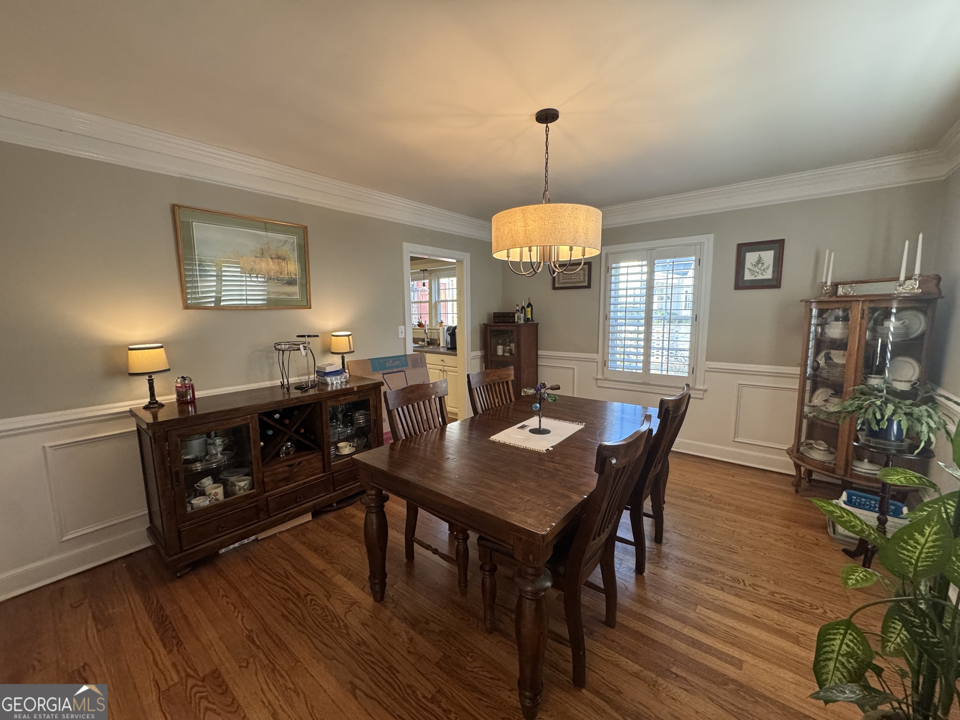 722 Maple Drive Griffin, GA 30224 - Photo 6 of 28 a view of a dining room with furniture window and wooden floor