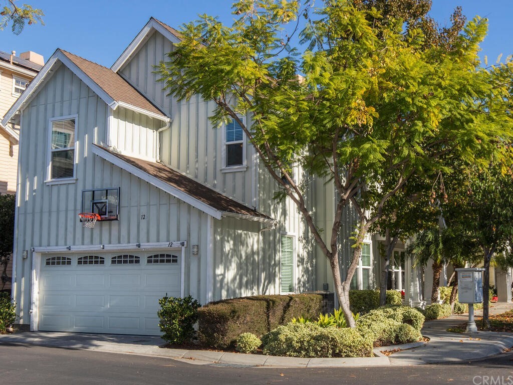 12 Thorp Ladera Ranch, CA 92694 - Photo 1 of 1 a front view of a house with a yard garage and outdoor seating