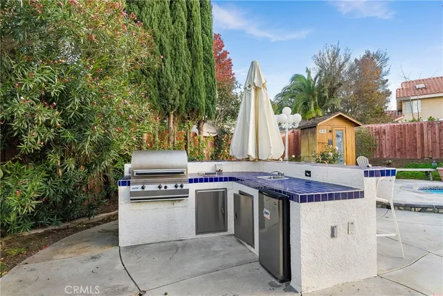 a view of outdoor space with granite countertop and barbecue grill