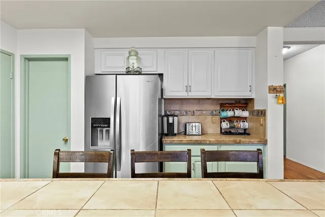 a kitchen with stainless steel appliances a refrigerator and a stove