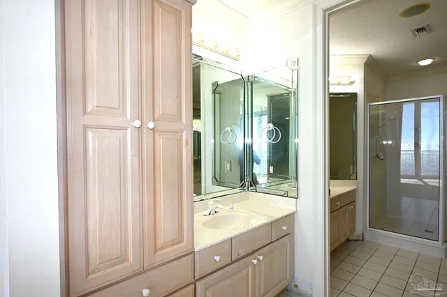 a bathroom with a shower and a sink