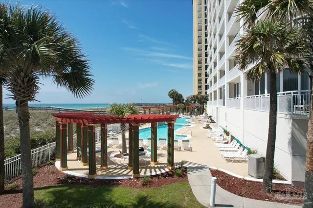 a view of balcony with furniture and garden