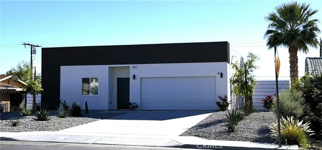 a view of a house with a street