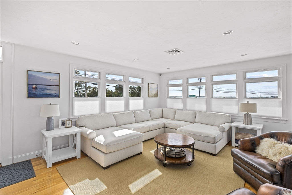 98 Central Avenue Scituate, MA 02066 - Photo 13 of 37 a living room with furniture and a large window