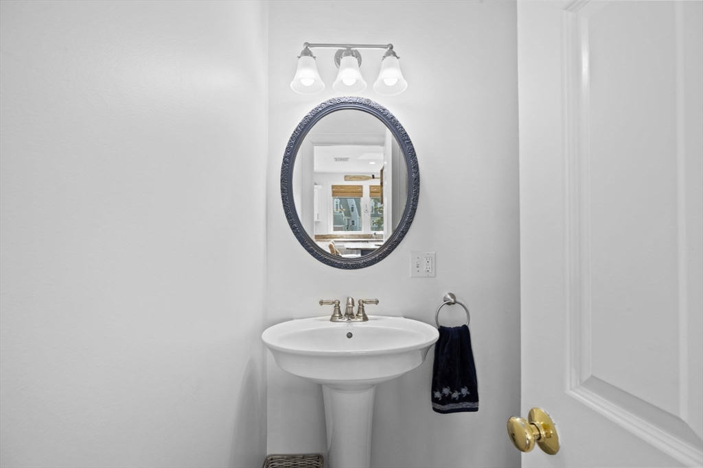 98 Central Avenue Scituate, MA 02066 - Photo 16 of 37 a bathroom with a sink and a mirror