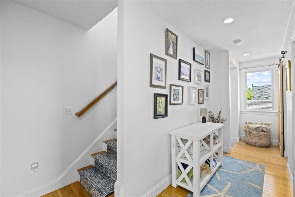 98 Central Avenue Scituate, MA 02066 - Photo 17 of 37 a bedroom with furniture and a wooden floor