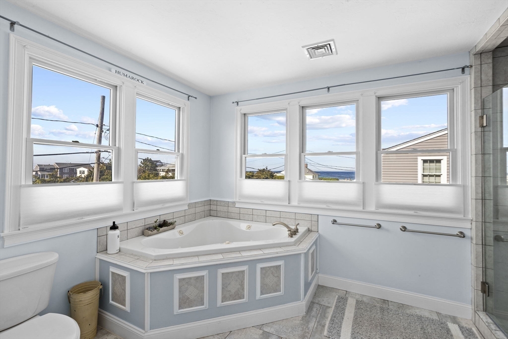 98 Central Avenue Scituate, MA 02066 - Photo 21 of 37 a white bath tub sitting next to a window