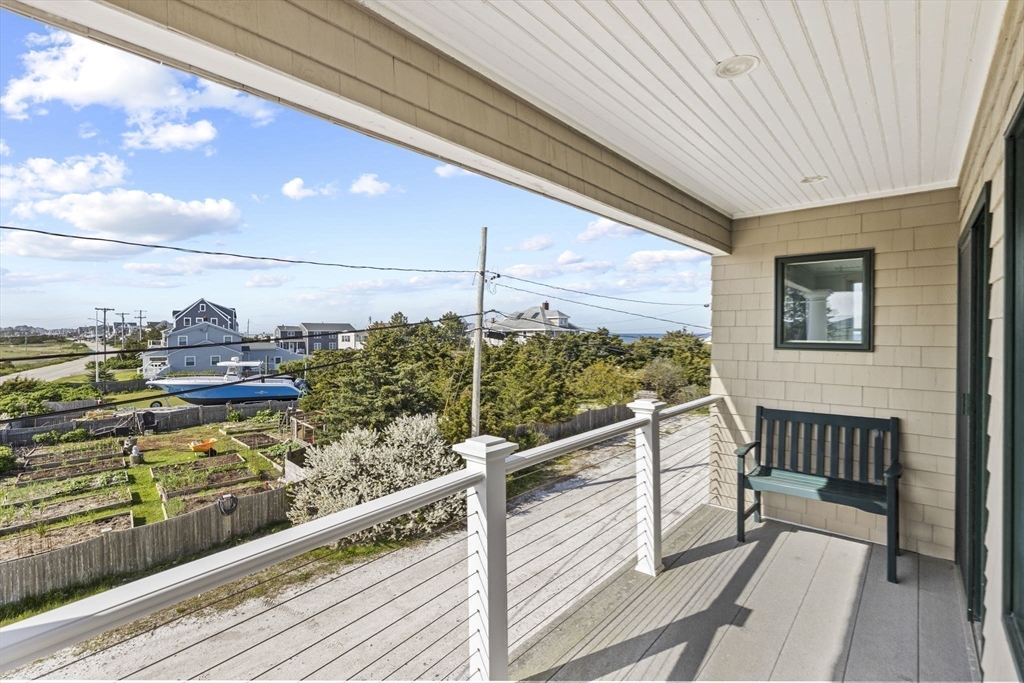 98 Central Avenue Scituate, MA 02066 - Photo 24 of 37 a view of a balcony with wooden chairs