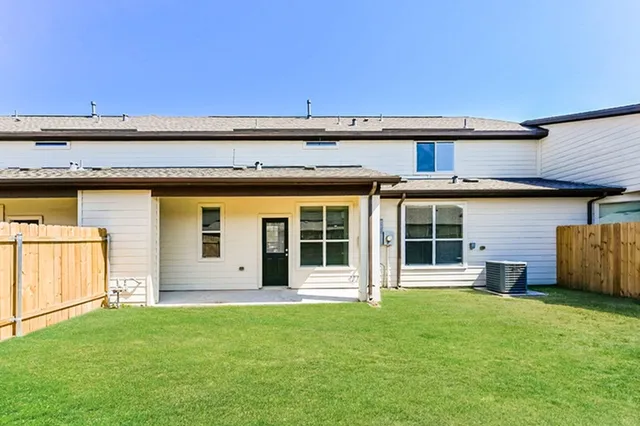front view of a house with a garden